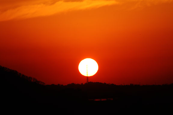 [The setting sun]