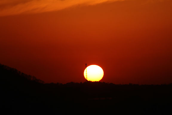 [The setting sun]